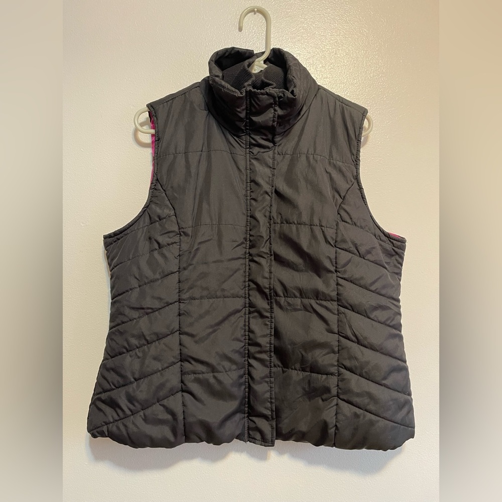 Outer Edge puffer vest zipper and button closure